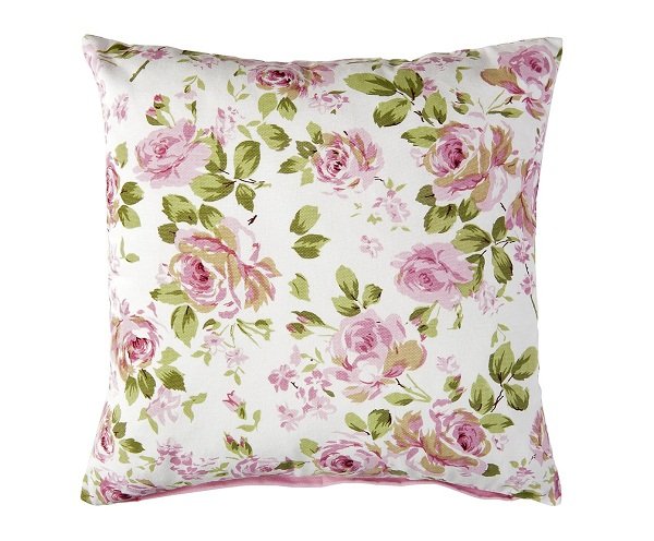 Housse de coussin élégante avec un fond blanc et un imprimé de fleurs roses et de feuilles vertes